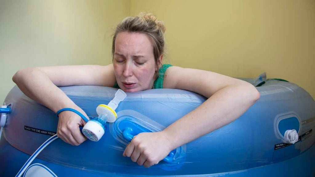 pregnant woman in labor using inflatable tub