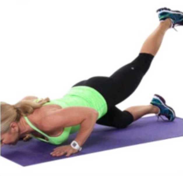 woman in one leg pushup position