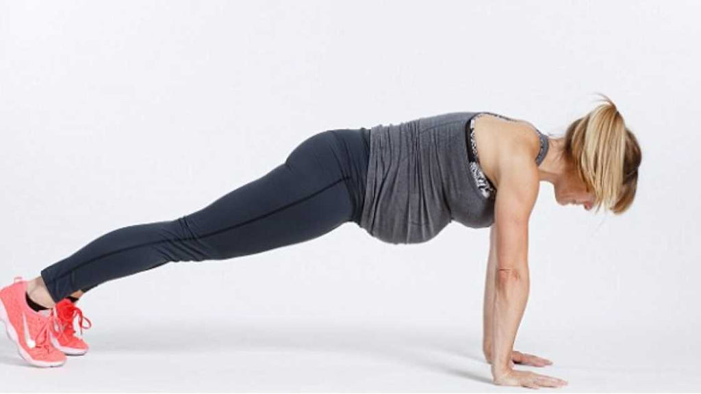 pregnant woman in full pushup position