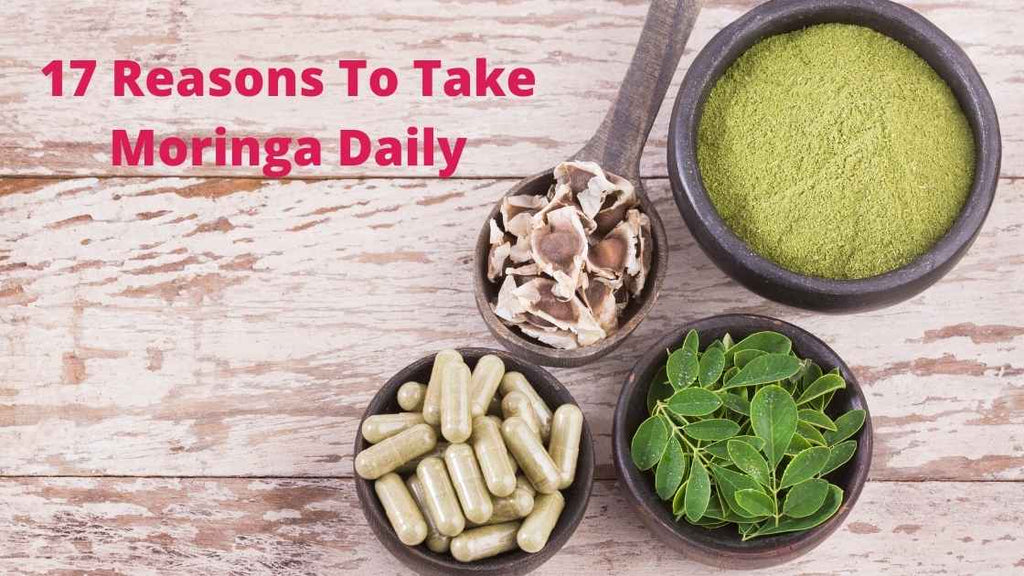 Moringa seeds, powder, leaves, supplement on wooden table