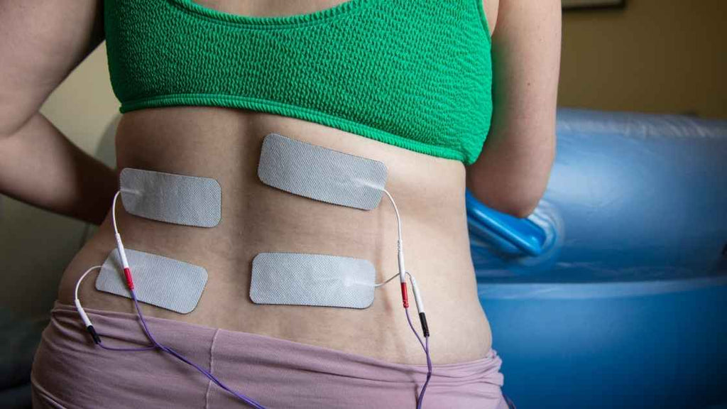 pregnant woman in labor using tens machine