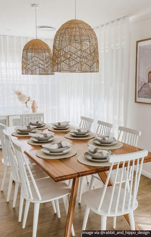 Wicker pendant light over dining table