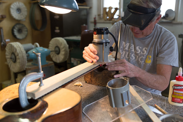 Lining up the Jig on a Guitar Repair at Mass Street Music