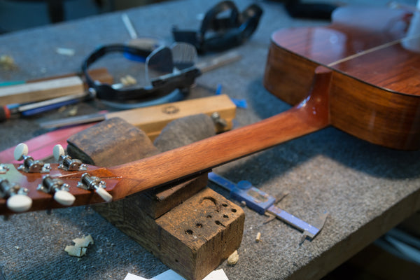 Lining up the Jig on a Guitar Repair at Mass Street Music