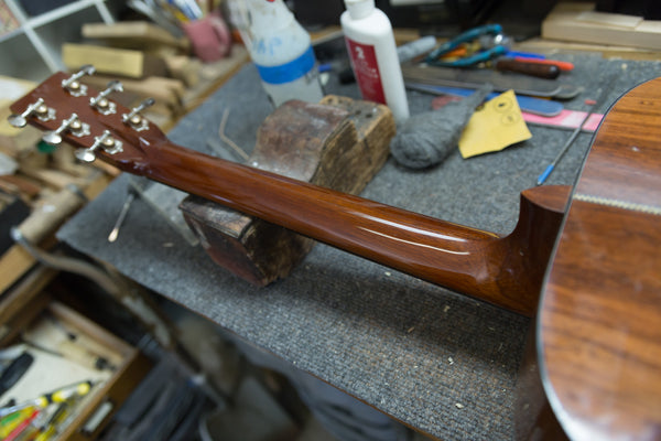 Lining up the Jig on a Guitar Repair at Mass Street Music