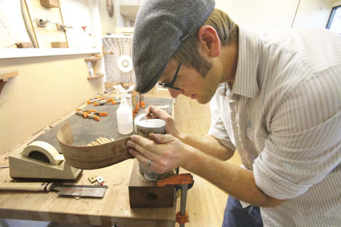Andy Powers working in guitar shop
