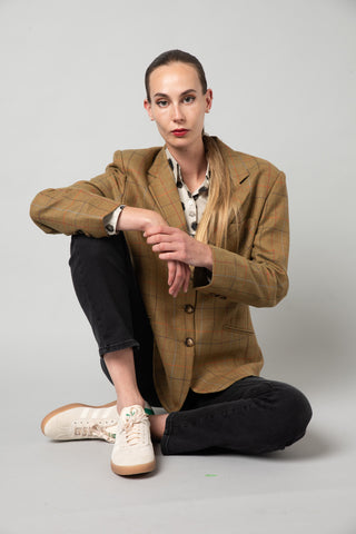 model wears goodness brown jacket and black pants