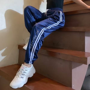 navy blue joggers with white stripe