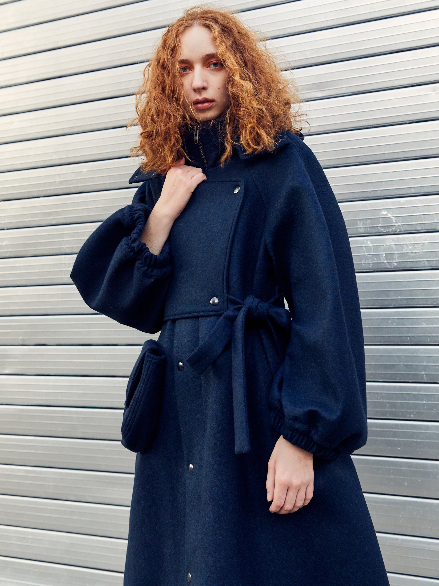 Navy wool coat with stand collar by Henrik Vibskov