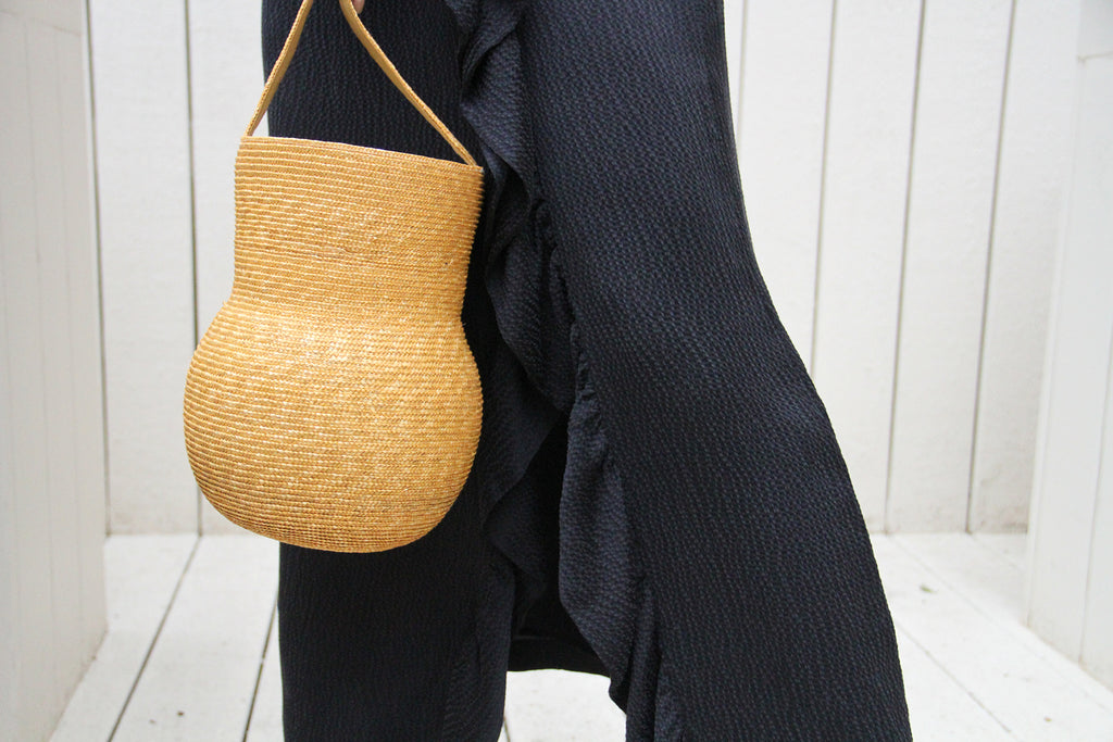 Structured woven straw bag in natural gold color by Samujit