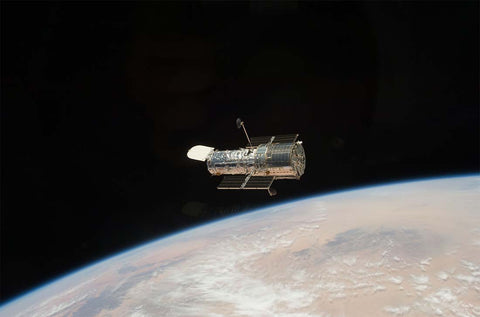 Hubble Telescope above planet Earth - Image Credit NASA