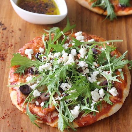 Aleppo chili flakes sprinkled on homemade pizza