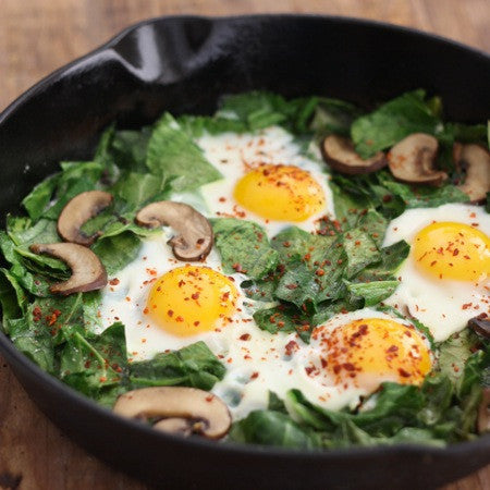 Collard green with eggs skillet spiced with aleppo chili flakes
