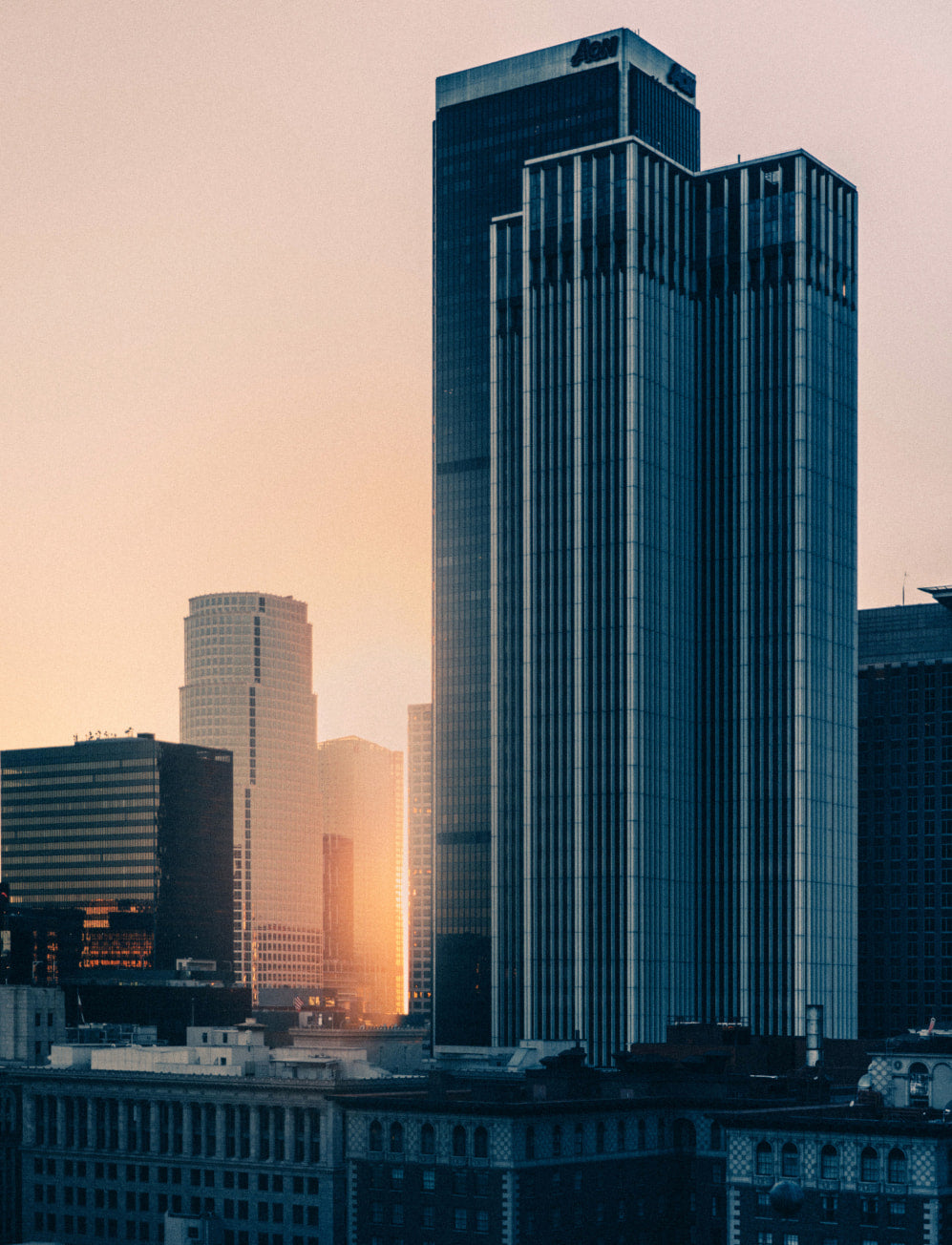 A cityscape is illuminated in the evening sun