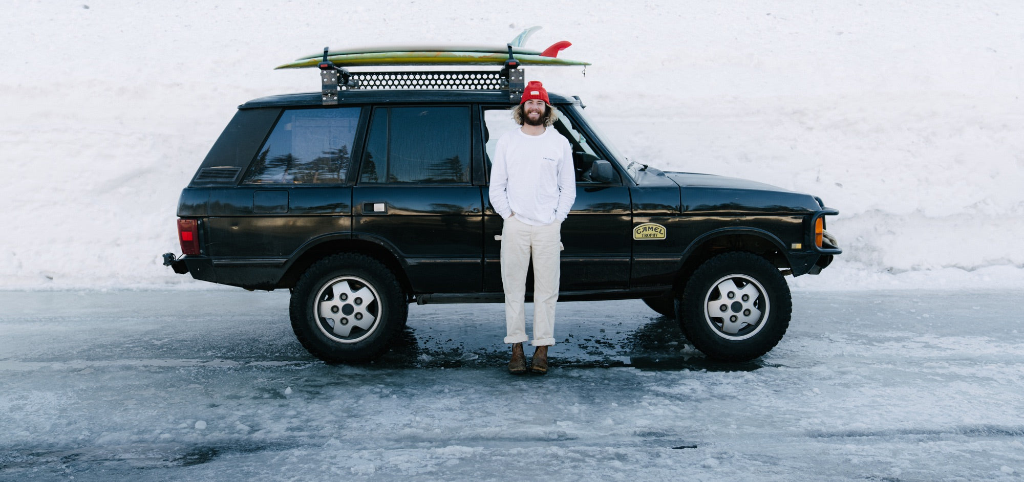 Brandon Haley poses and smiles infront of his 4x4