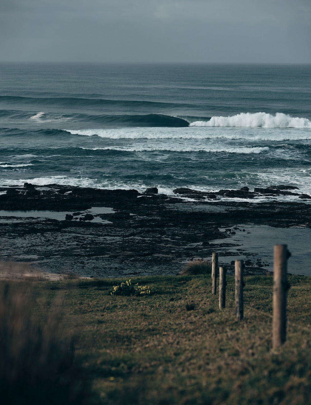 Sense of adventure: A view of a perfect barrelling wave from a cliff top