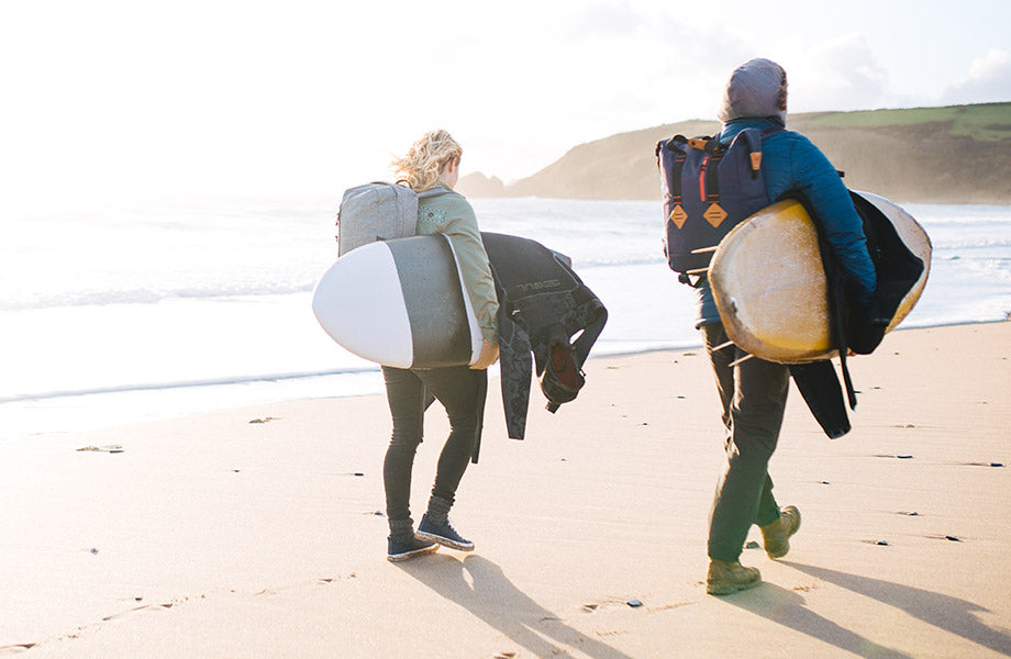 Man & Women walking along the beach