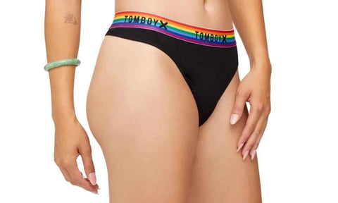 person wearing black thong with rainbow band