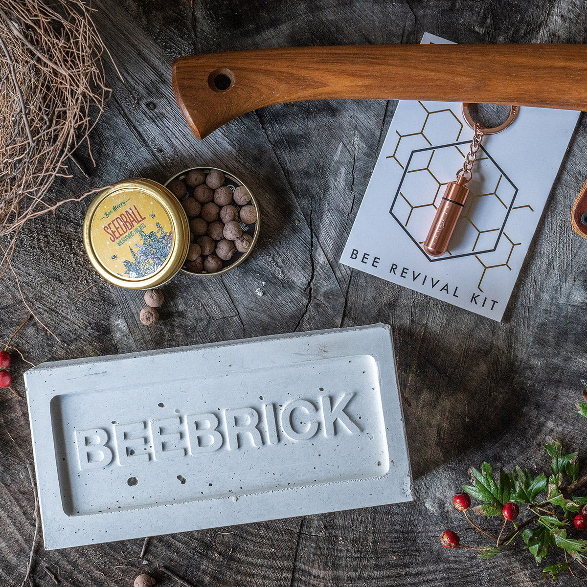 Bee themed gift bundle for nature lovers featuring bee brick and beevive and seedball seeds tin wildflowers