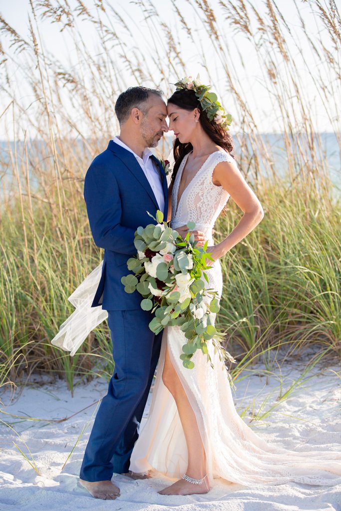 Kristin and James' real wedding on the beach with romantic, tousled wavy bridal hairstyle.