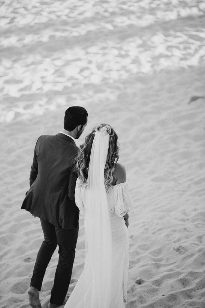Add an elegant veil to your romantic, tousled wedding hairstyle to complete your beach bridal style. 