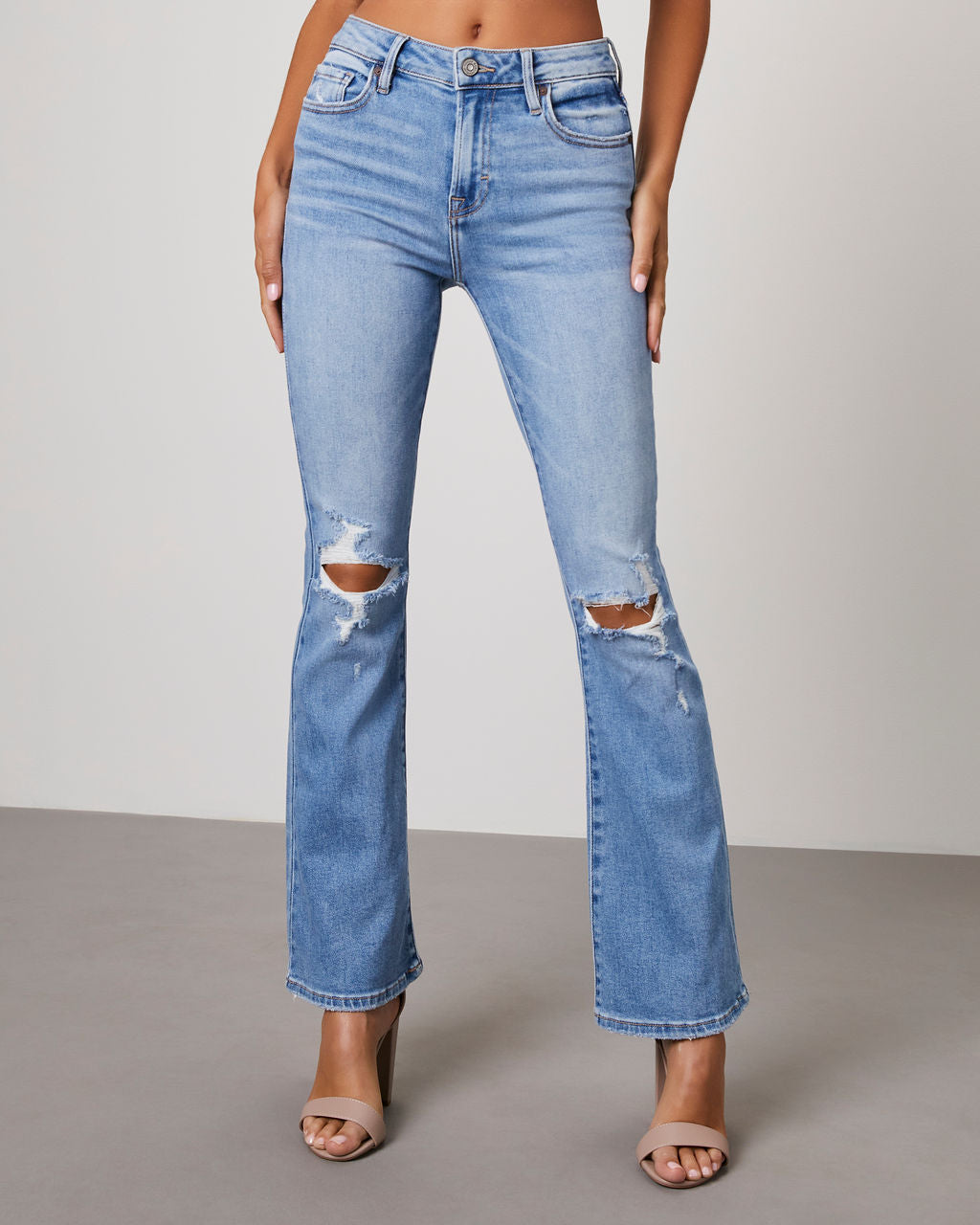 

Malika High Rise Distressed Flare Jeans