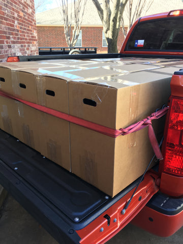 XPO Trainer 2s boxed and loaded in the bed of a pickup truck for shipping
