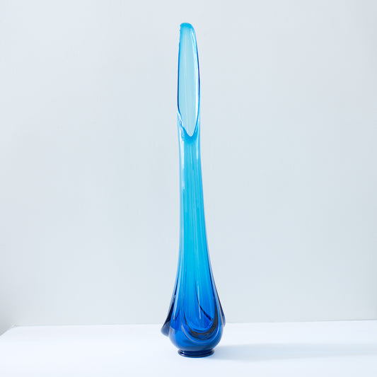 https://cdn.shopify.com/s/files/1/0205/3742/products/Midcentury_Blue_Glass_Sculpture_Vase_4_533x.jpg?v=1605577737