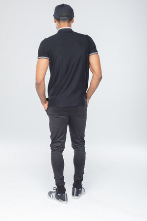 black polo gray pants