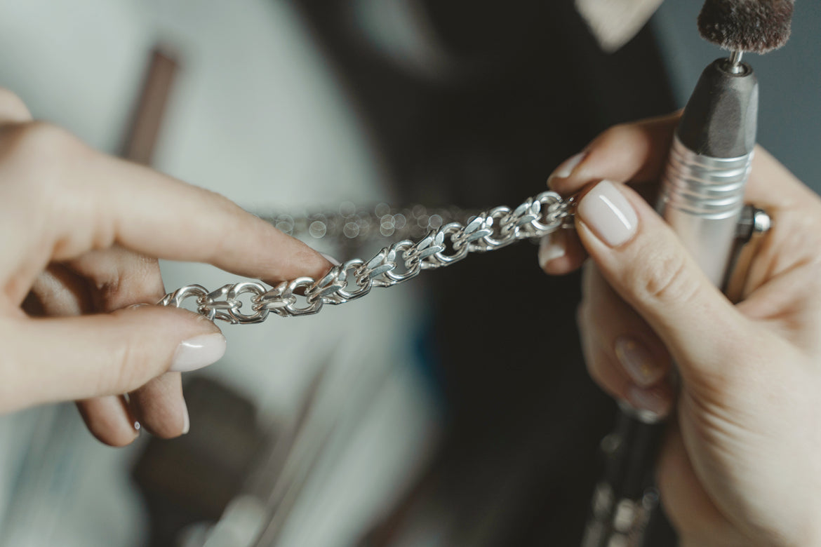 woman holding a silver bracelet - sugarkittenlondon