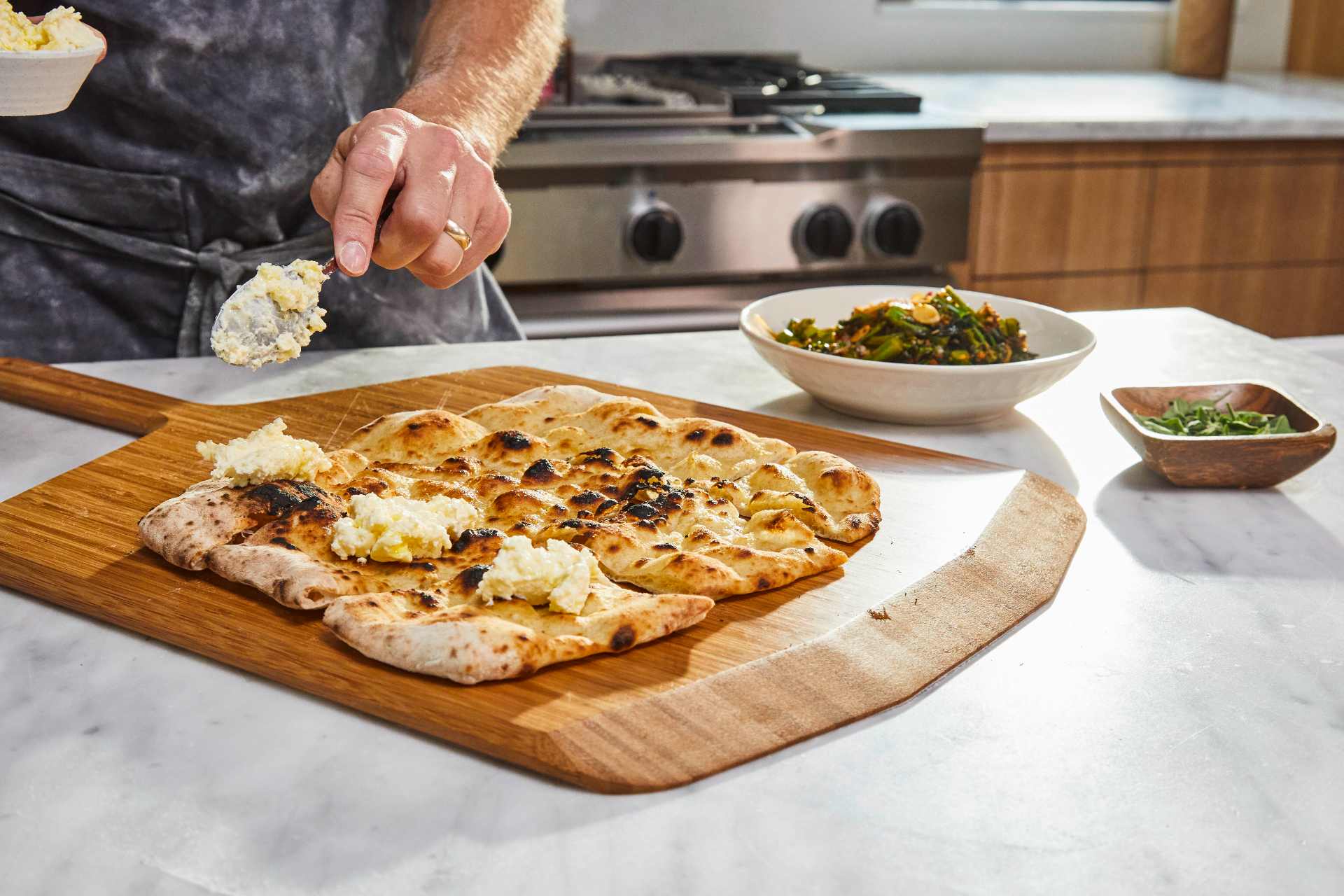 Pizza Crostini with Ricotta and Marinated Broccolini