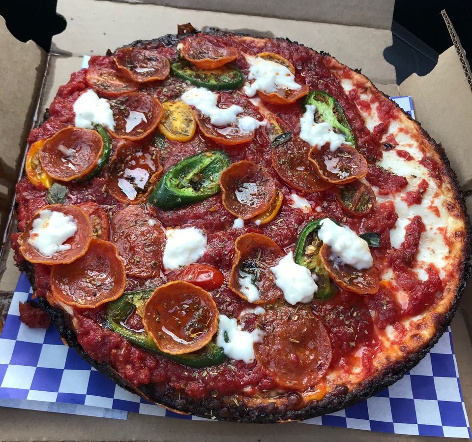 Chicago style deep dish pizza topped with pepperoni and jalapenos from Milly's Pizza in the Pan