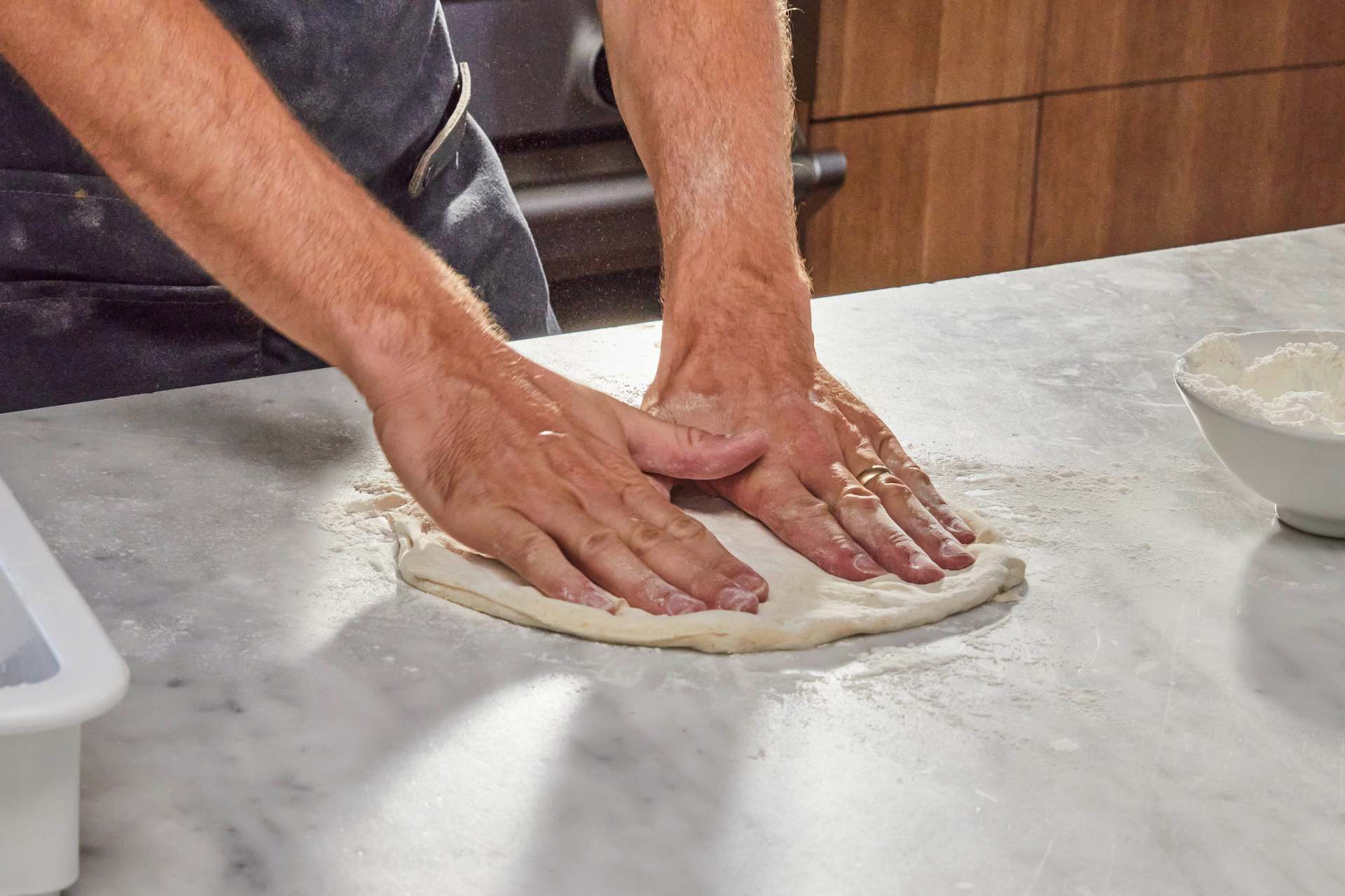 Stretching pizza dough