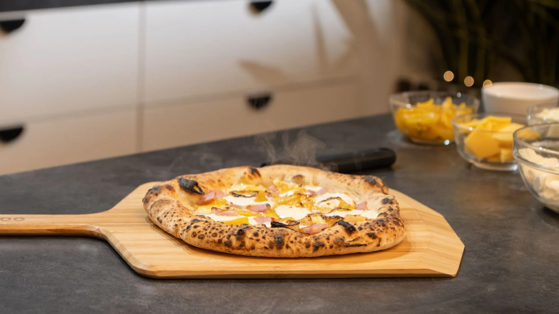 Cooked pumpkin pizza with ham and mozzarella on top of a Bamboo Pizza Peel & Serving Board on a table. David Sherman David Sherman 12:26 PM Feb 5 UK/AU/NZ: Cooked pumpkin pizza with ham and mozzarella on top of a Bamboo Pizza Peel & Serving Board on a table.