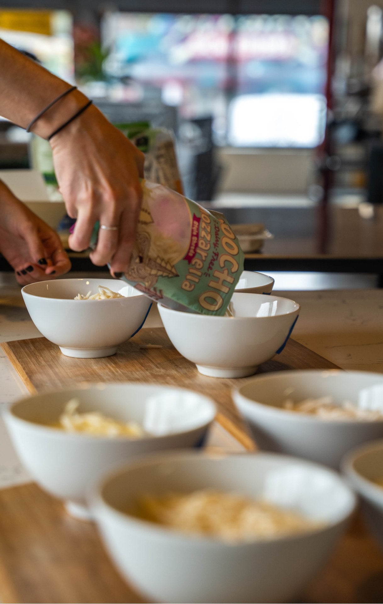 Vegan cheese being poured into bowls