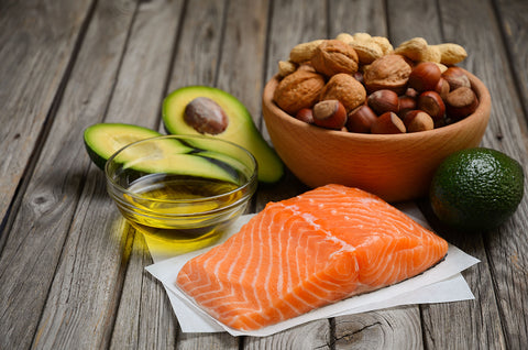 Healthy fats include salmon, avocado, olive oil, and whole nuts and seeds.