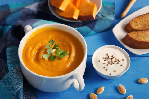 Soup and pastries on a blue background