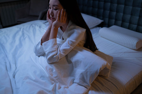 Woman in bed having anxiety and insomnia