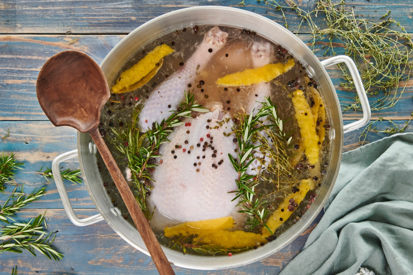 A Christmas turkey in a pot full of brine flavoured with spices, citrus and herbs