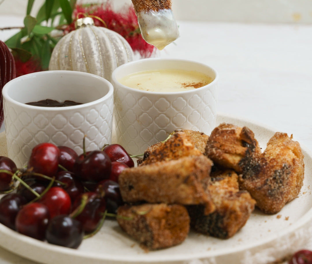 Churros-style dippers made from panettone with cherries on the side