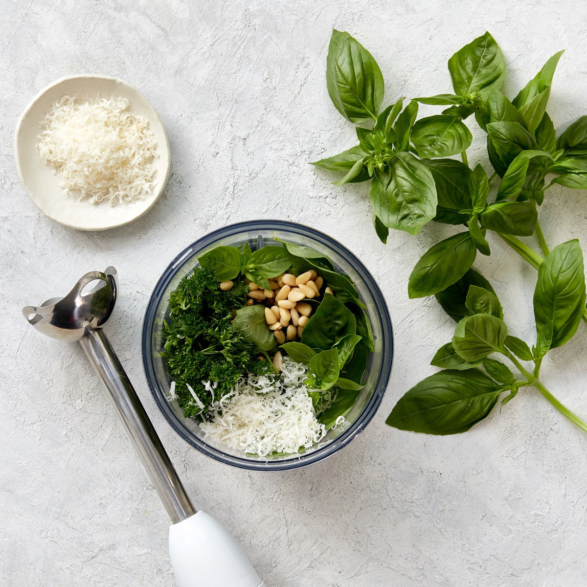 A photo of pesto being made from fresh basil