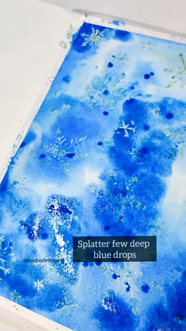 splatter a few drops of deep blue paint 