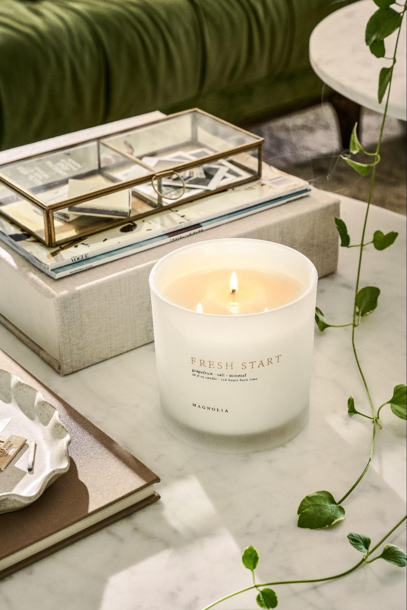 Candle and decor on marble tabletop