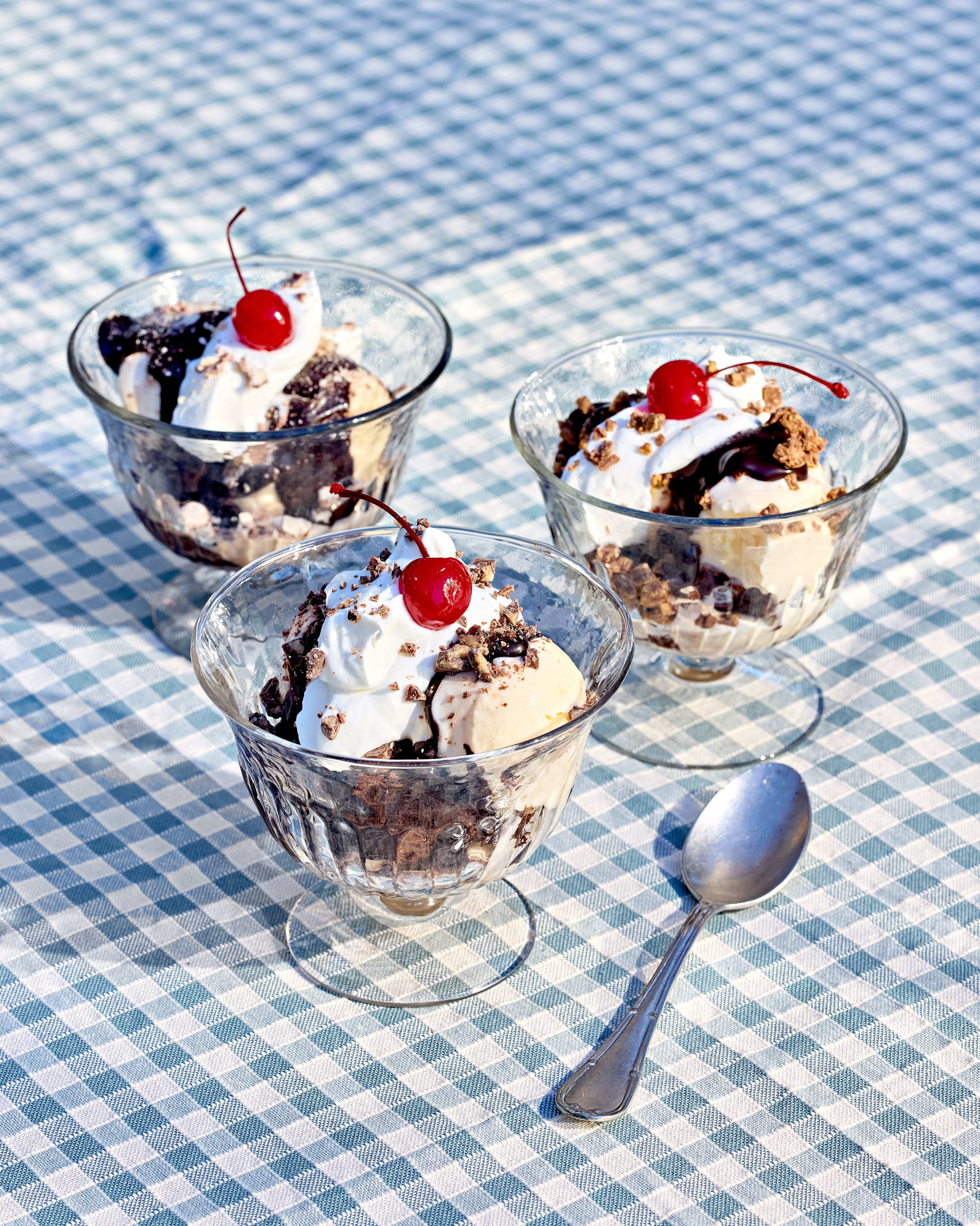 Brownie Sundaes on a blue gingham tablecloth, as seen in the summer 2025 Magnolia Journal.
