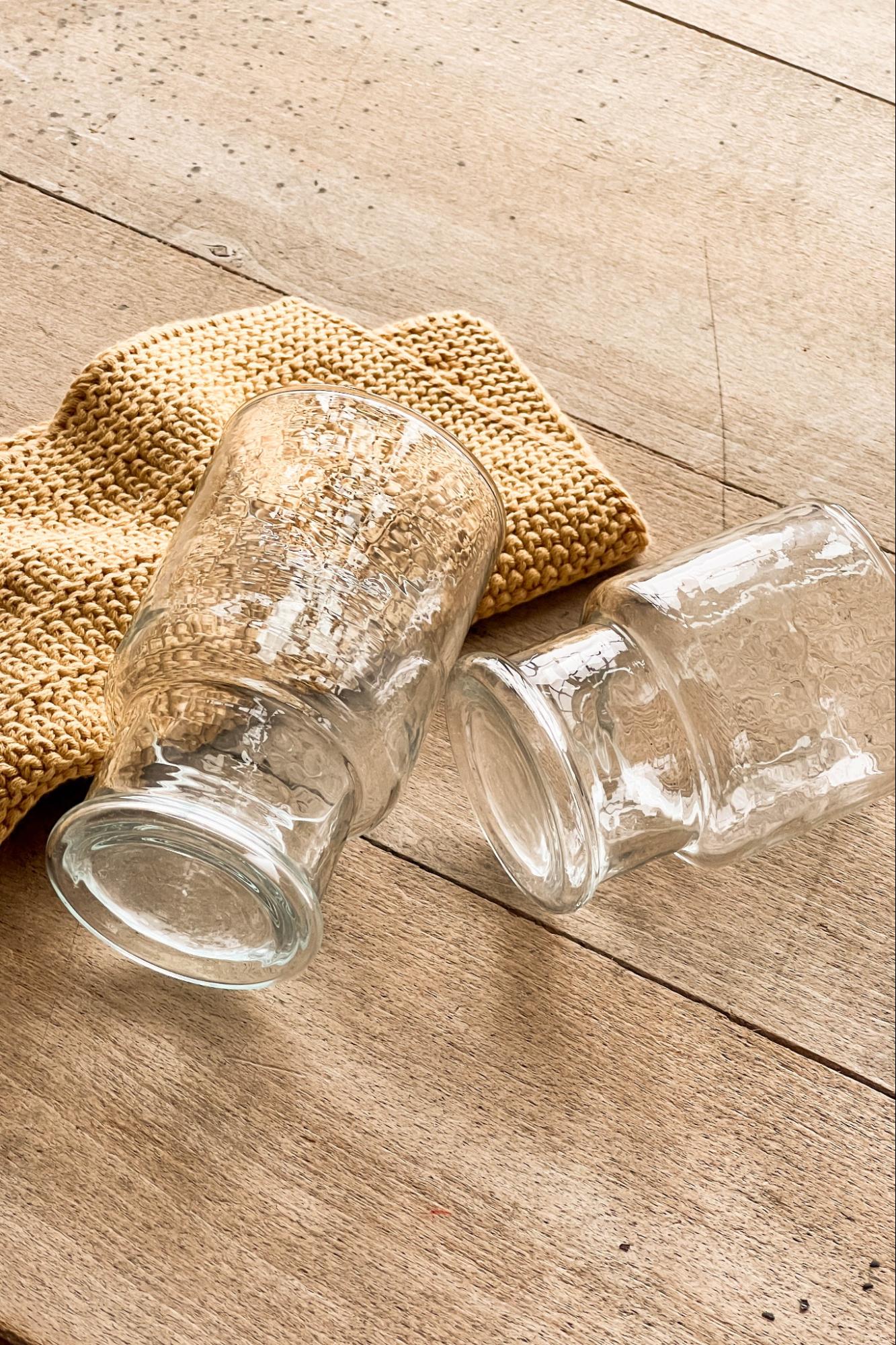 Two of the Magnolia Rustic Glass Stacking Tumblers. 