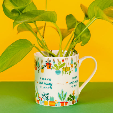 Plant Addict mug, with a plant inside