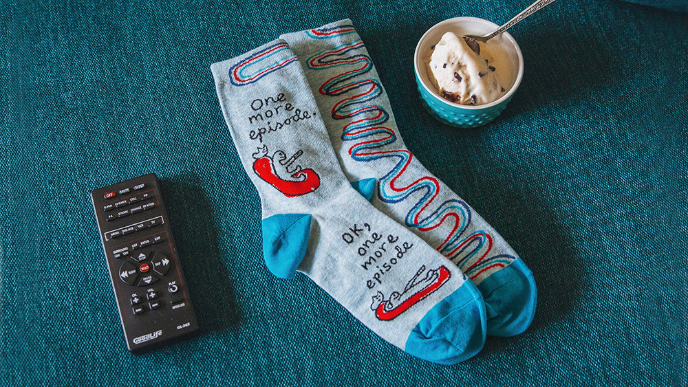 Funny novelty TV socks that say, "One more episode"