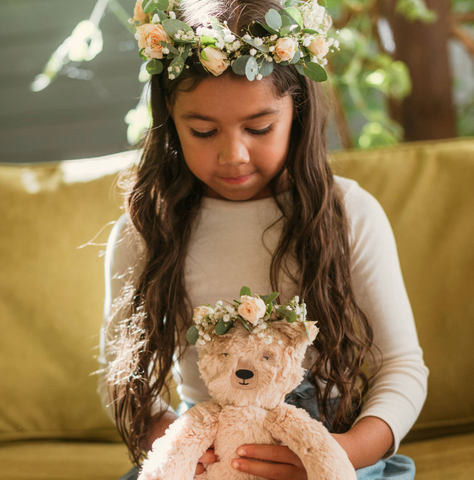 girl and slumberkins stuffed animal in flower crowns