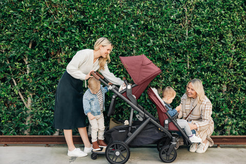 Family using UPPAbaby VISTA for three children with Rumbleseat and PiggyBack Board