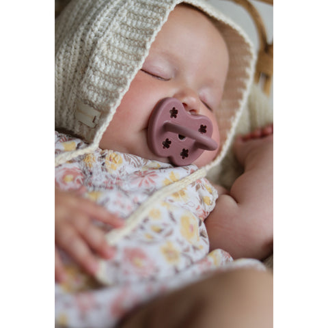 Baby with Hevea Binkie Soothed to Sleep